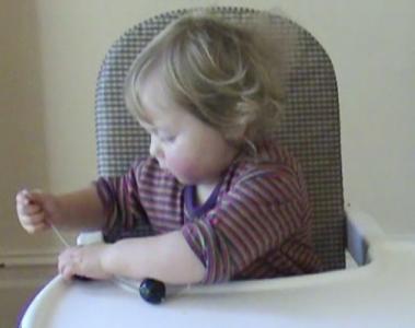 Lily 17months threading beads 1.jpg