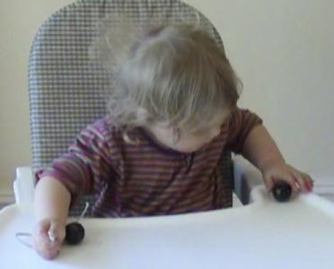 Lily 17months threading beads 2.jpg