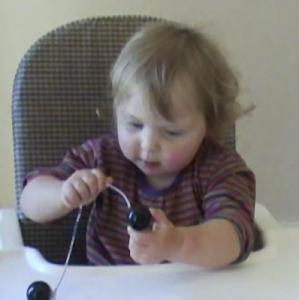 Lily 17months threading beads 3.jpg
