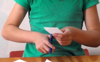 cutting-straight-line-angling-paper-supporting-hand.jpg