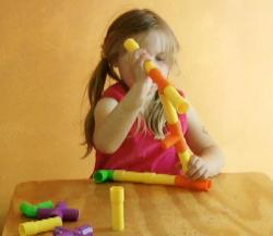child-4y-9m-assembling-toy.jpg