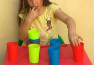 child-midline-crossing-moving-cups-1.jpg